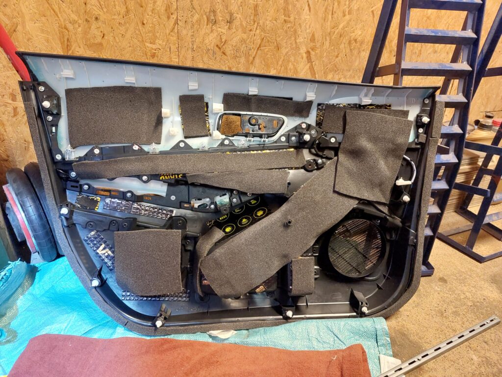 2024 Toyota Corolla front door card with butyl damping and foam treatment