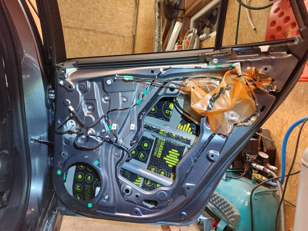 CTK butyl damping applied to the outer skin of a 2024 Toyota Corolla rear door